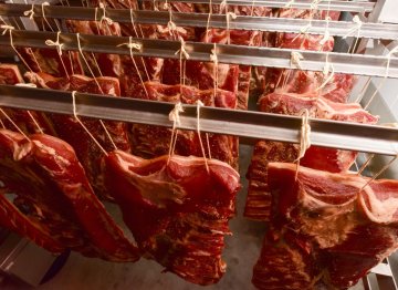 The raw meat dries hanging